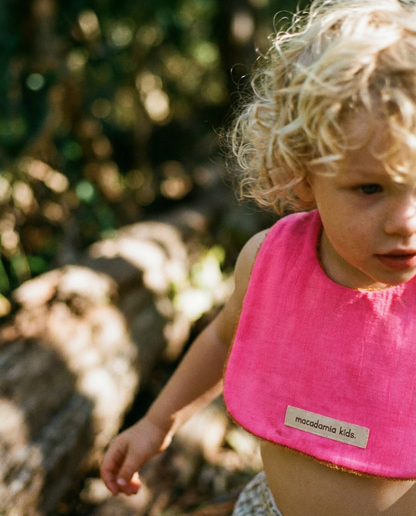 Reversible orange/fuchsia cotton terry bib