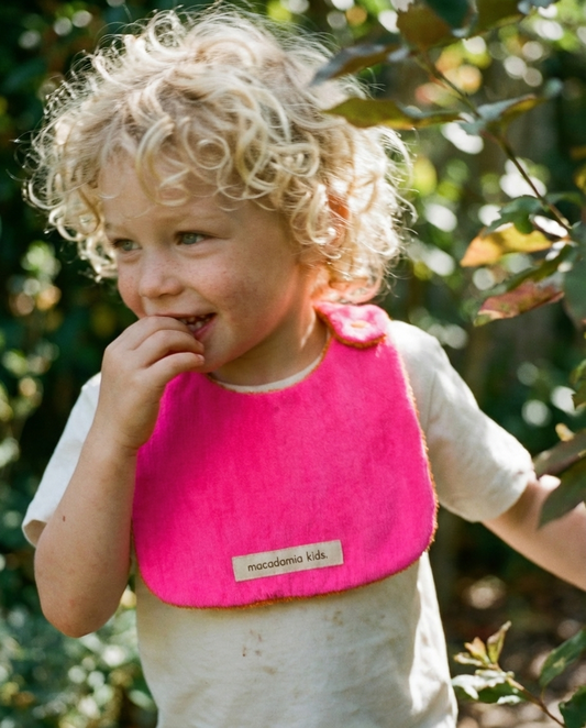 Babero reversible naranja/fucsia rizo de algodón