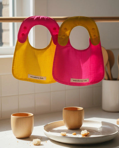 Pack de 2 baberos reversibles amarillo/fucsia