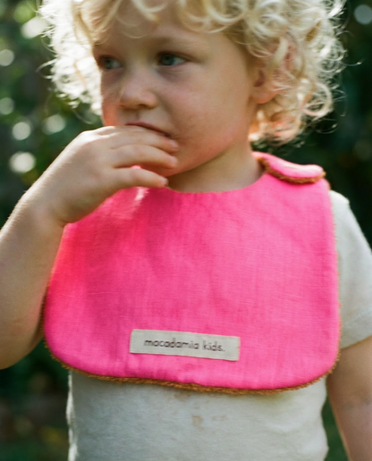 Reversible orange/fuchsia cotton terry bib