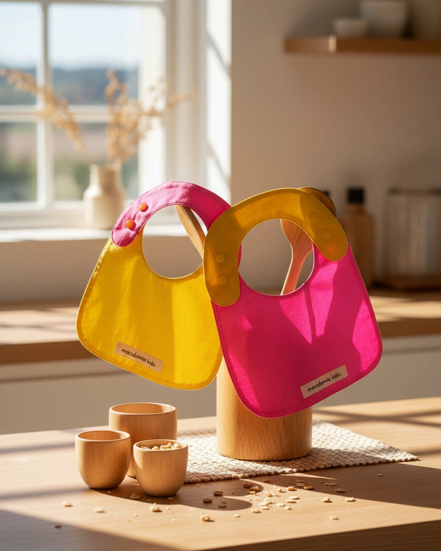 Pack de 2 baberos reversibles amarillo/fucsia