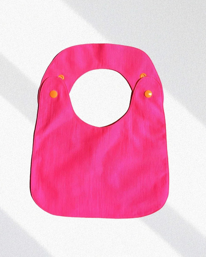 Pack de 2 baberos reversibles amarillo/fucsia