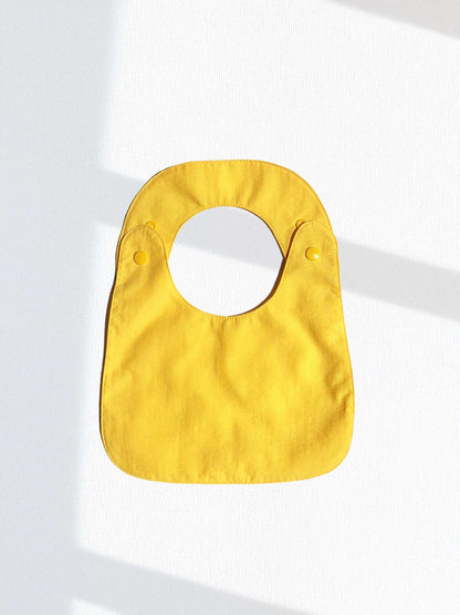 Babero reversible (disponible en 2 colores)