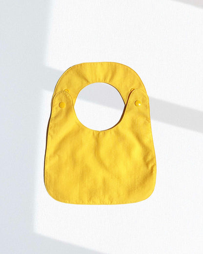 Babero reversible (disponible en 2 colores)