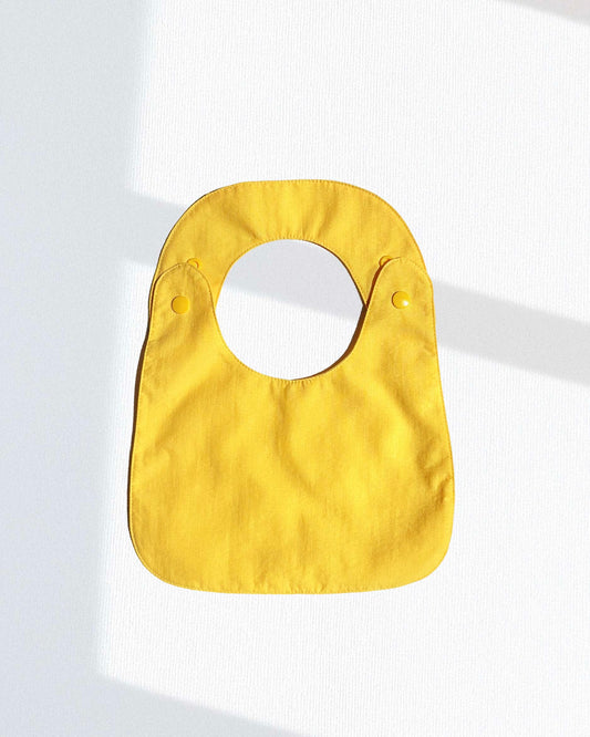 Babero reversible (disponible en 2 colores)
