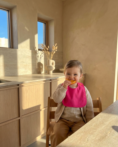 Babero reversible fucsia